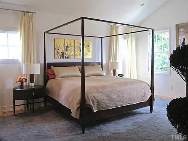 2108 Blue Oak Terrace Raleigh, NC 27608 - Photo 12 of 25 a bedroom with a bed and a window