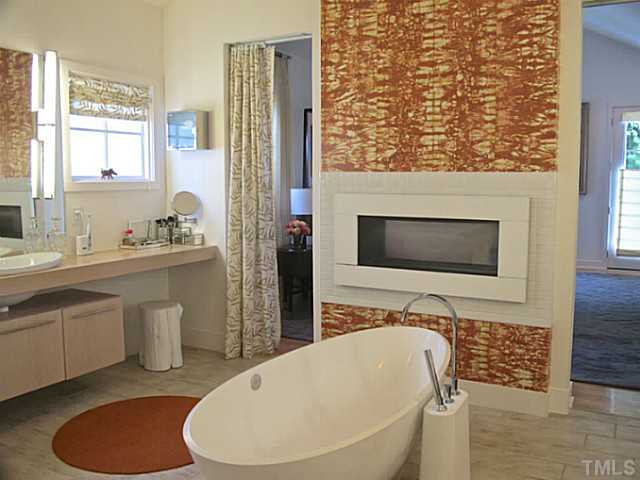 2108 Blue Oak Terrace Raleigh, NC 27608 - Photo 14 of 25 a bathroom with a toilet sink and mirror