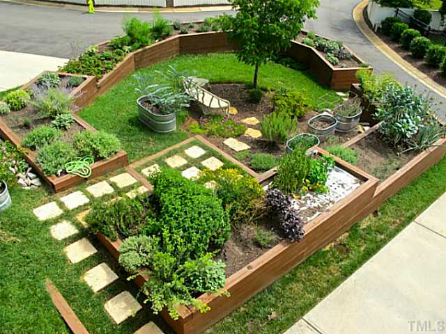 2108 Blue Oak Terrace Raleigh, NC 27608 - Photo 24 of 25 a view of a garden with a flower in a garden