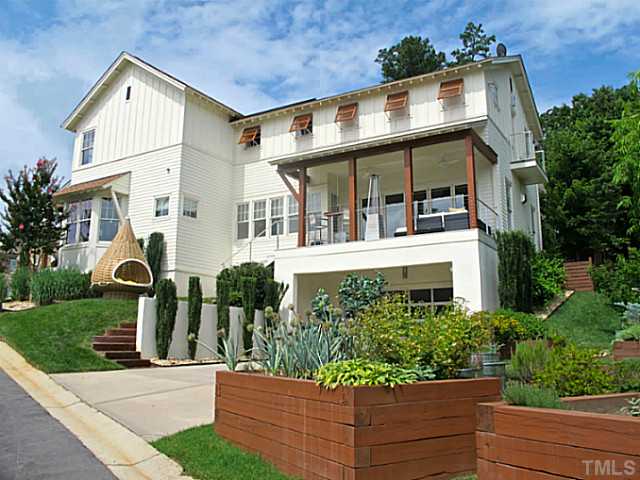 2108 Blue Oak Terrace Raleigh, NC 27608 - Photo 25 of 25 front view of house with a yard and potted plants
