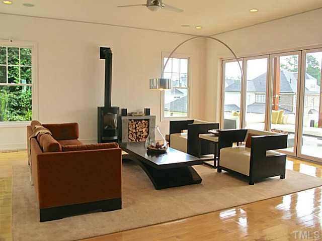 2108 Blue Oak Terrace Raleigh, NC 27608 - Photo 6 of 25 a living room with furniture and floor to ceiling windows