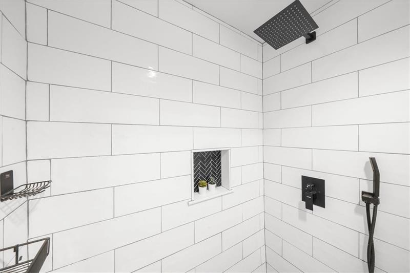 3475 Oak Valley Road Northeast, Unit 410 Atlanta, GA 30326 - Photo 14 of 36 a bathroom with a shower