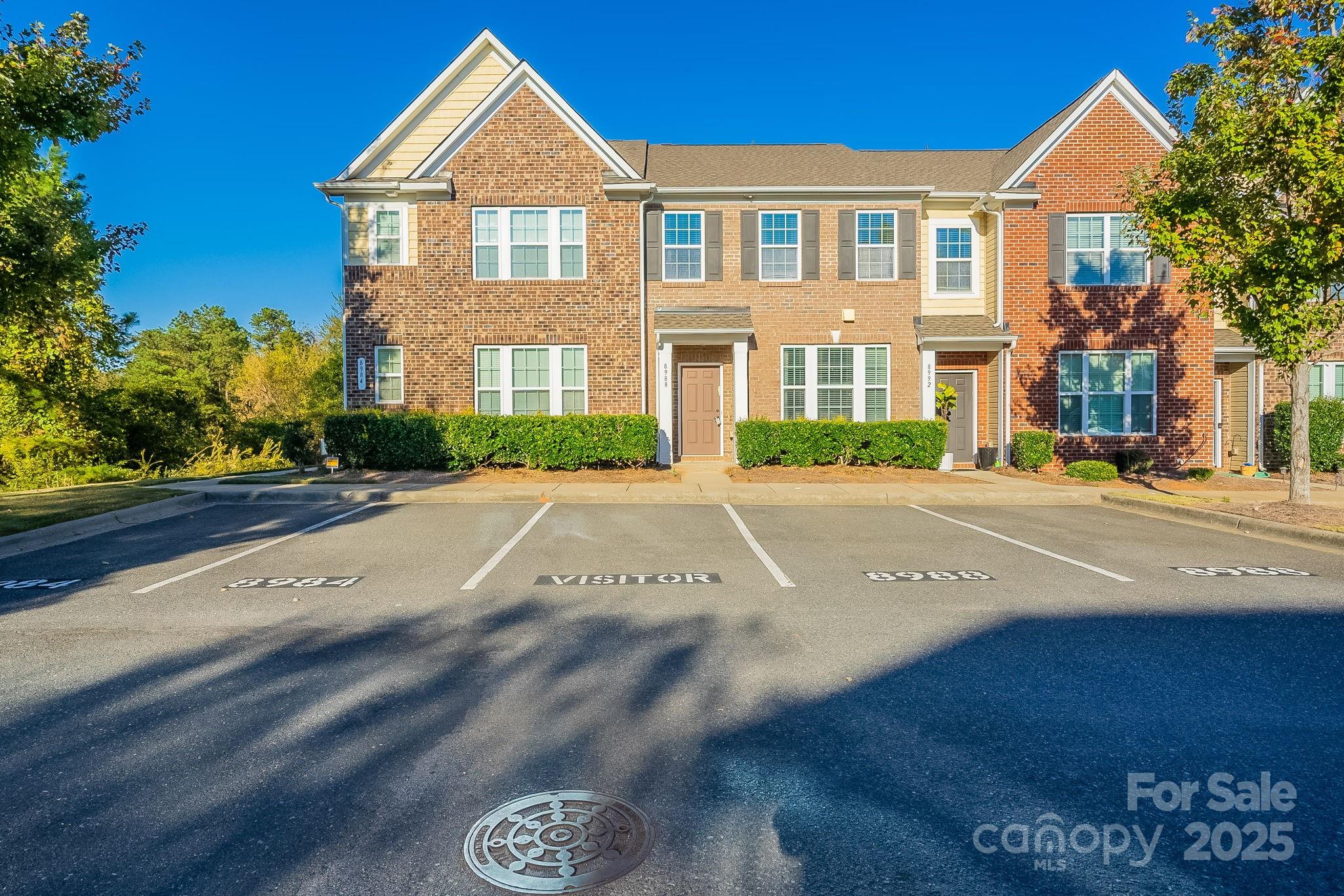 8988 Lanark Lane Fort Mill, SC 29707 - Photo 1 of 43 a front view of a house with a yard