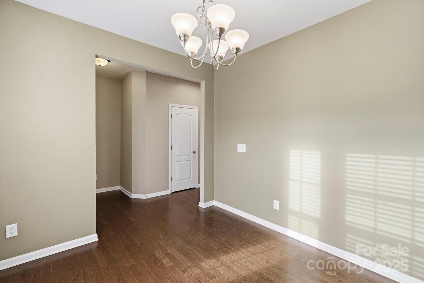 8988 Lanark Lane Fort Mill, SC 29707 - Photo 15 of 43 wooden floor in an empty room with a window