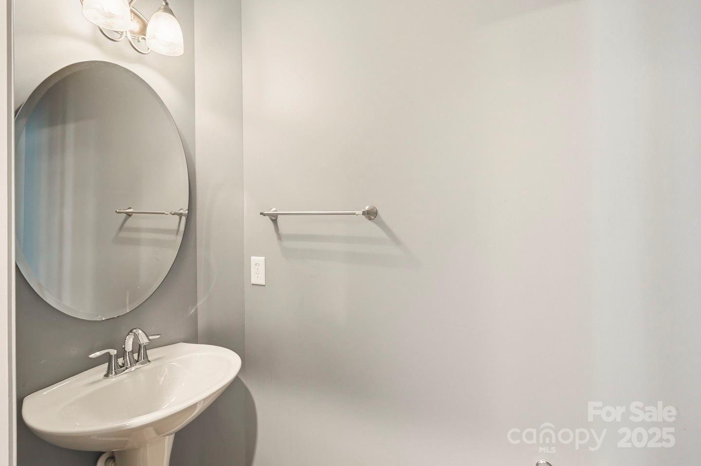 8988 Lanark Lane Fort Mill, SC 29707 - Photo 16 of 43 a bathroom with a sink a mirror and vanity