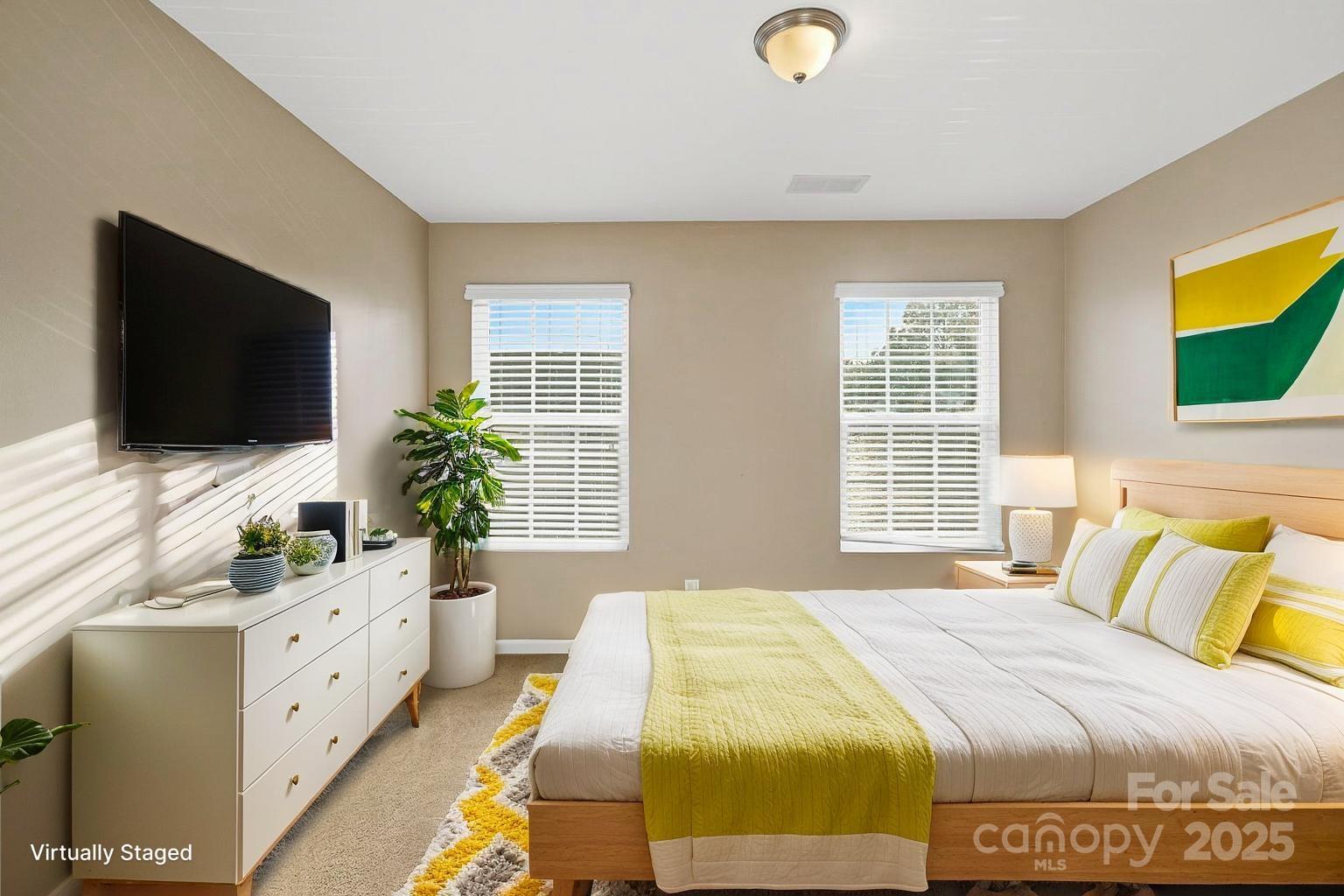 8988 Lanark Lane Fort Mill, SC 29707 - Photo 18 of 43 a bedroom with a bed and a flat screen tv