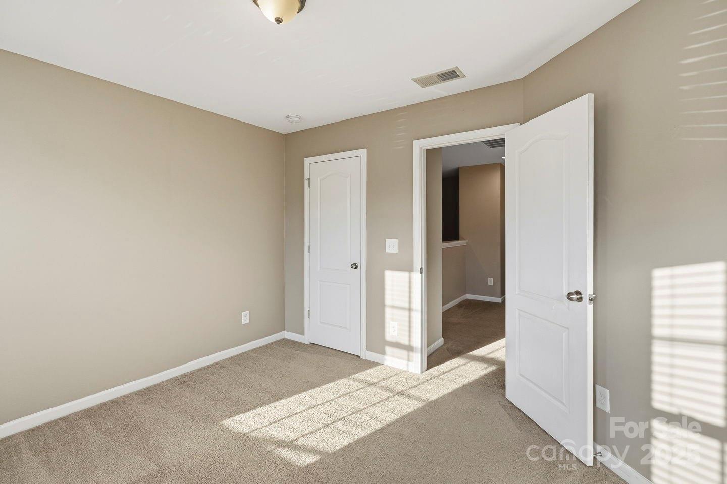 8988 Lanark Lane Fort Mill, SC 29707 - Photo 20 of 43 a view of a room with wooden floor and a bathroom
