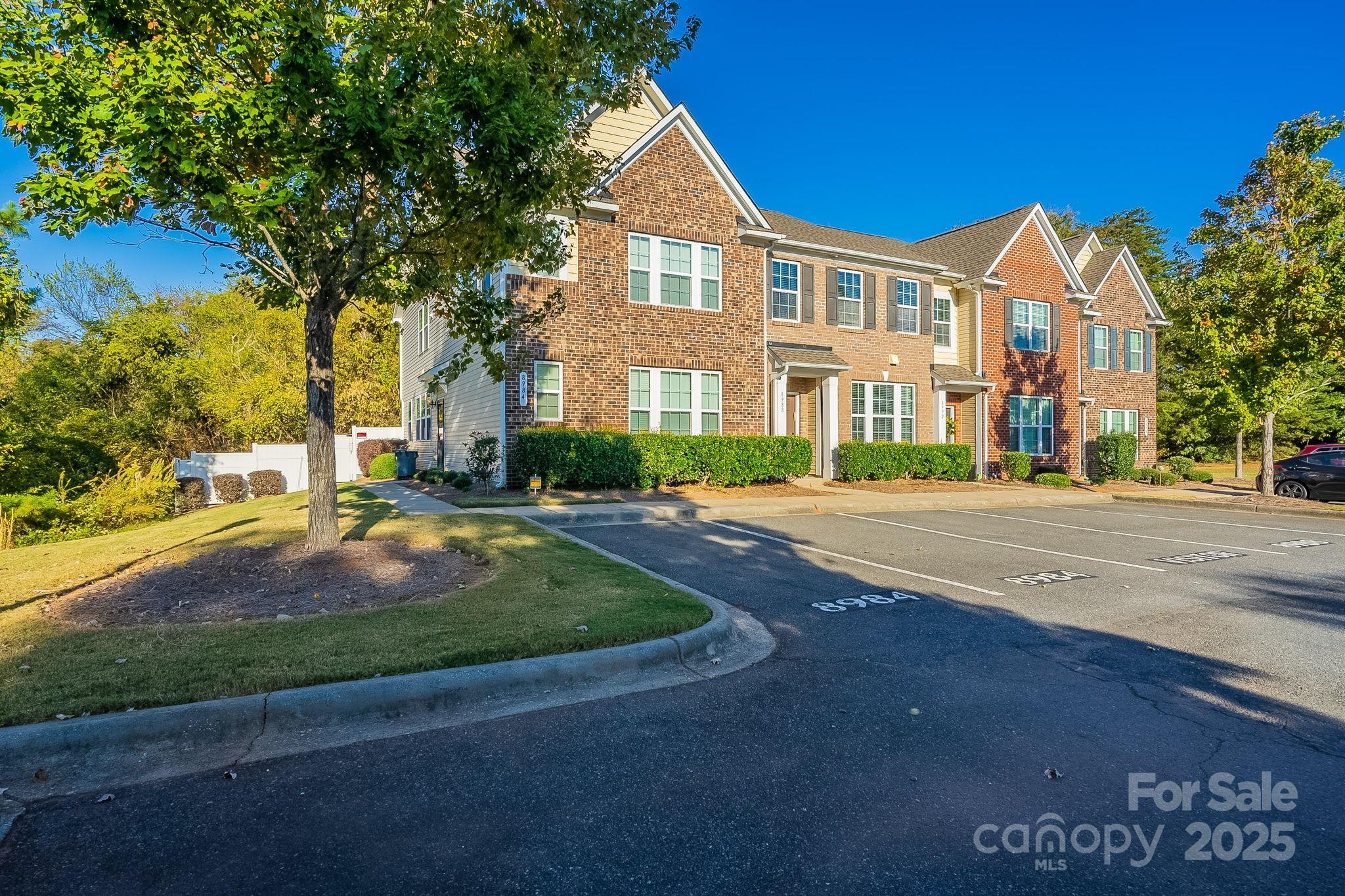 8988 Lanark Lane Fort Mill, SC 29707 - Photo 2 of 43 a front view of a house with yard and green space