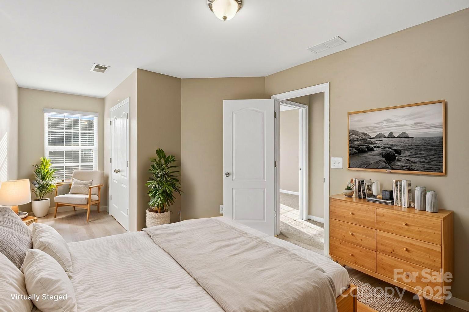 8988 Lanark Lane Fort Mill, SC 29707 - Photo 21 of 43 a bedroom with furniture and a flat screen tv