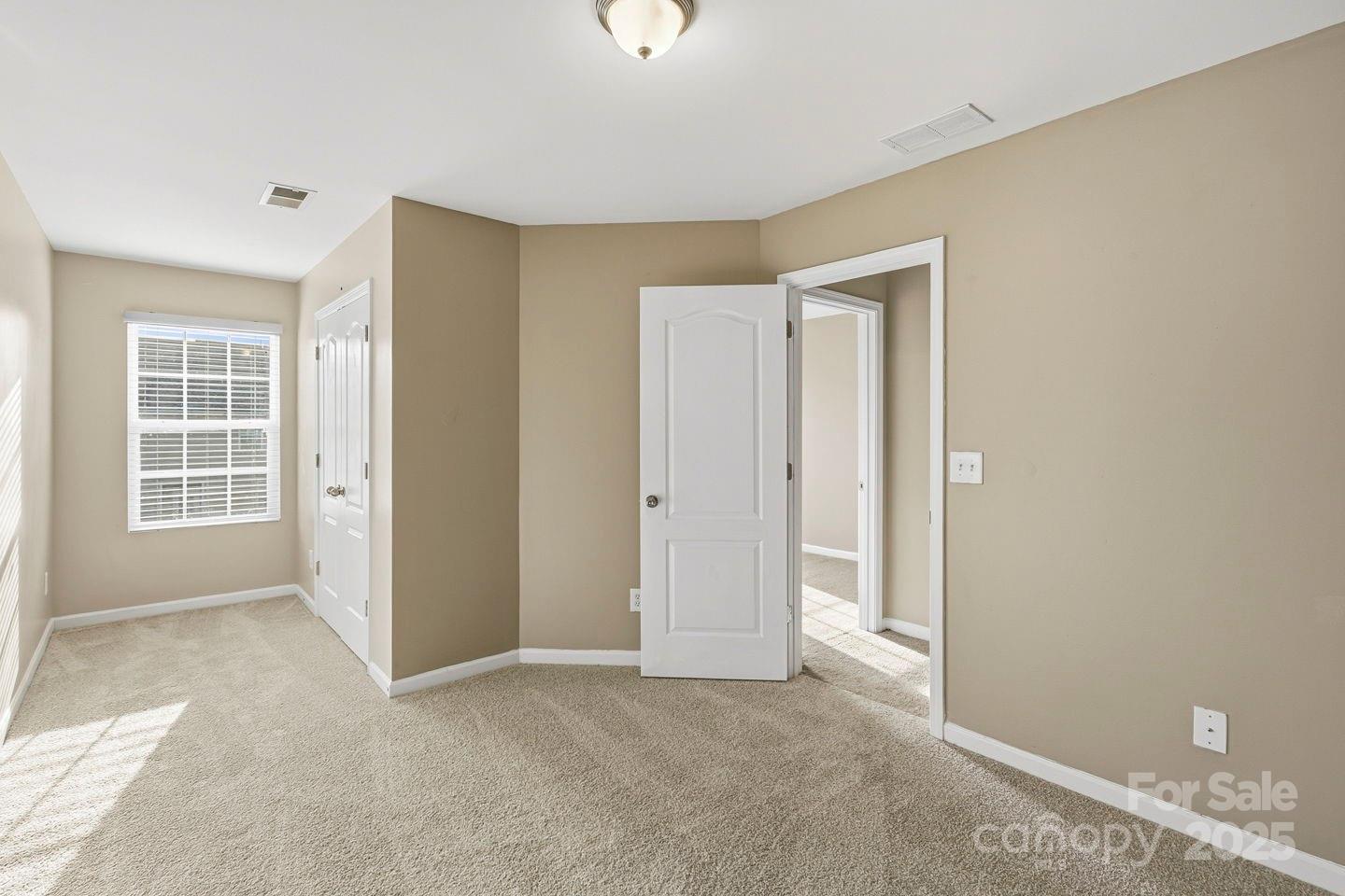 8988 Lanark Lane Fort Mill, SC 29707 - Photo 22 of 43 a view of an empty room with a window