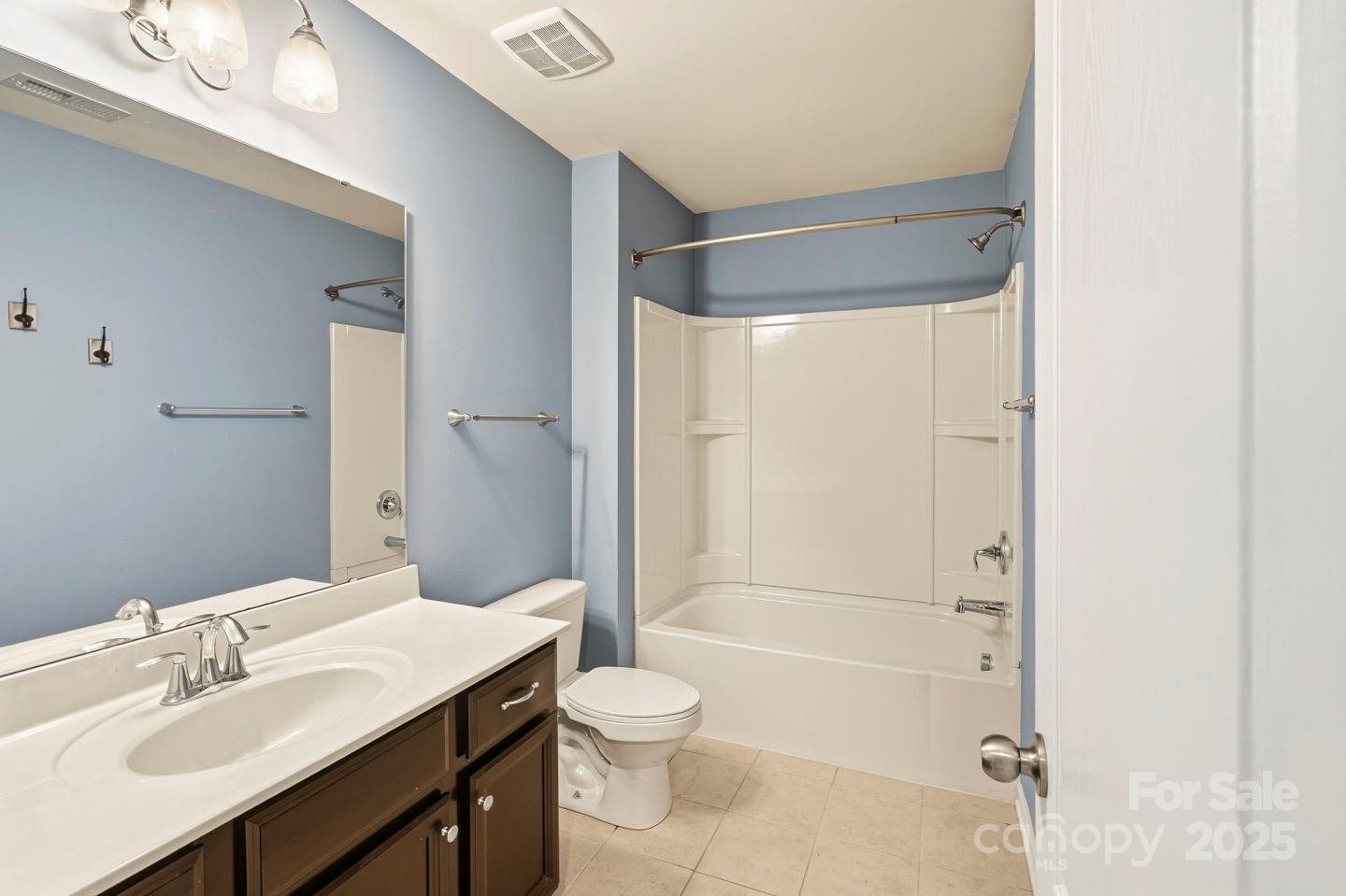 8988 Lanark Lane Fort Mill, SC 29707 - Photo 24 of 43 a bathroom with a sink a toilet and shower