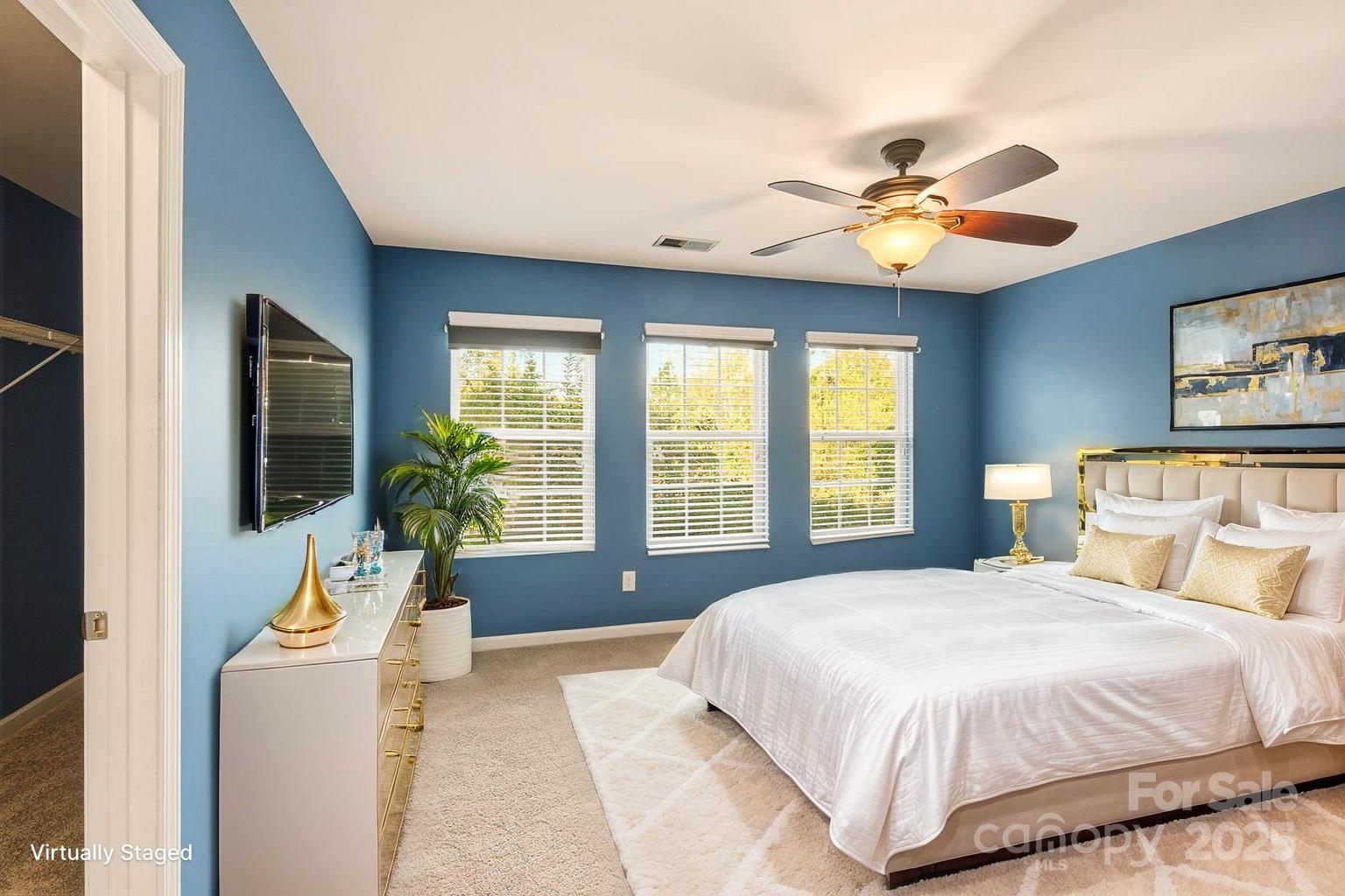 8988 Lanark Lane Fort Mill, SC 29707 - Photo 25 of 43 a bedroom with a large bed and a flat screen tv
