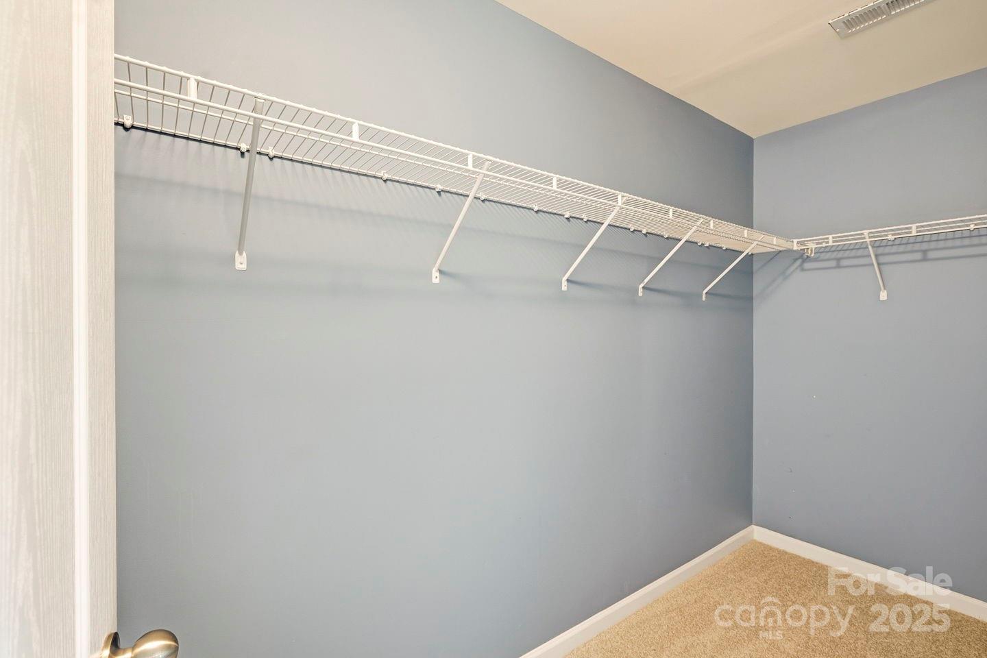 8988 Lanark Lane Fort Mill, SC 29707 - Photo 29 of 43 a view of a room with racks on the wall