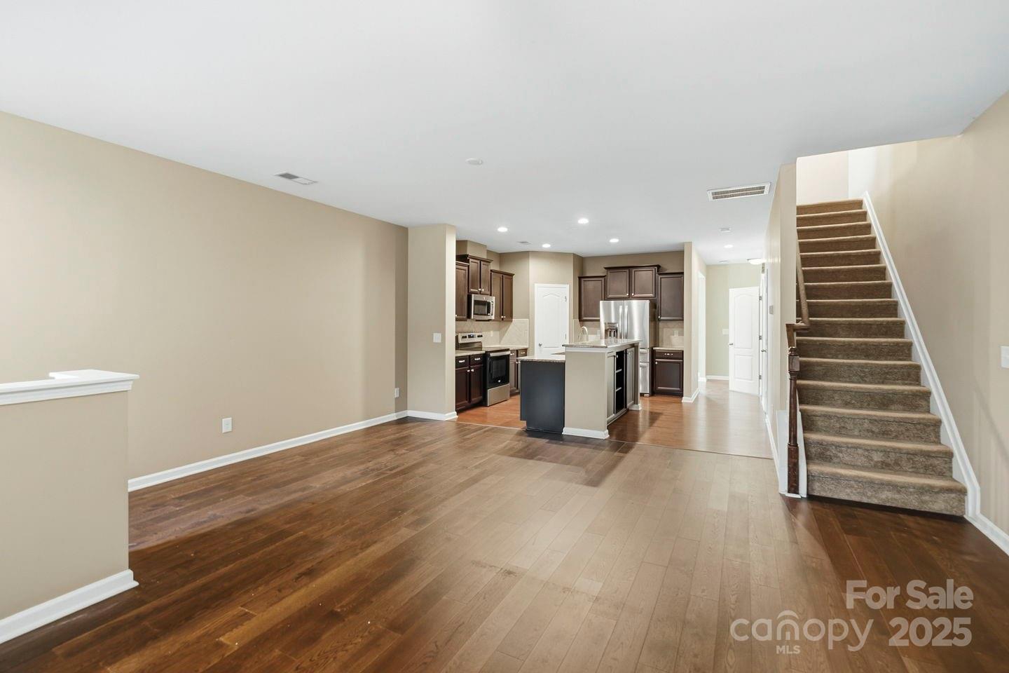 8988 Lanark Lane Fort Mill, SC 29707 - Photo 9 of 43 a view of kitchen and hall with wooden floor
