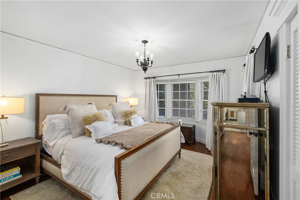 5306 Norwich Avenue Sherman Oaks, CA 91411 - Photo 16 of 43 a bed room with a bed furniture and a flat tv screen