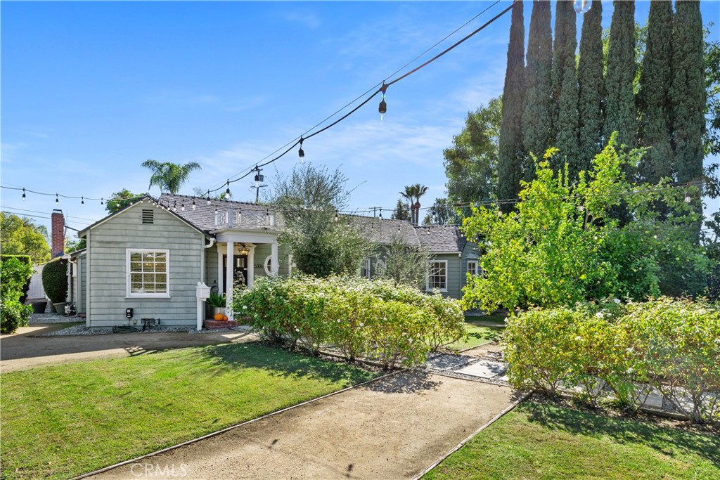 5306 Norwich Avenue Sherman Oaks, CA 91411 - Photo 2 of 43 a front view of a house with a garden