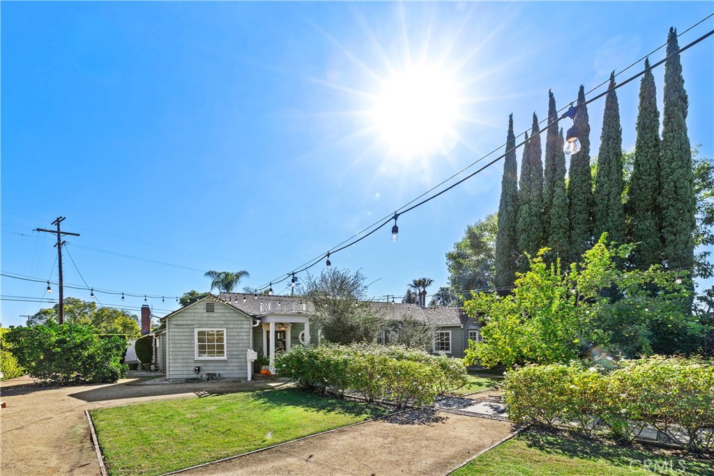 5306 Norwich Avenue Sherman Oaks, CA 91411 - Photo 34 of 43 a view of a house with a yard and potted plants