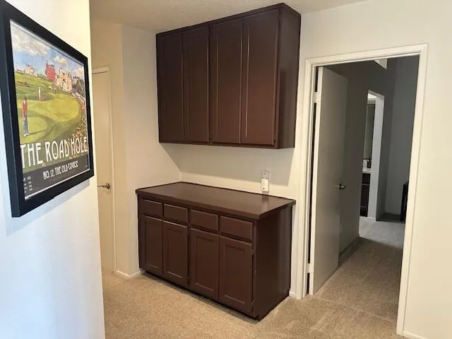 a kitchen with a refrigerator and a cabinets