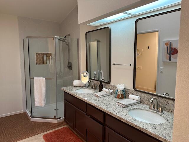 41869 Preston Trail Palm Desert, CA 92211 - Photo 13 of 23 a bathroom with a granite countertop double vanity sink and a mirror