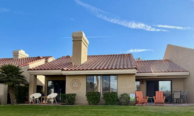 41869 Preston Trail Palm Desert, CA 92211 - Photo 23 of 23 a front view of a house with garden