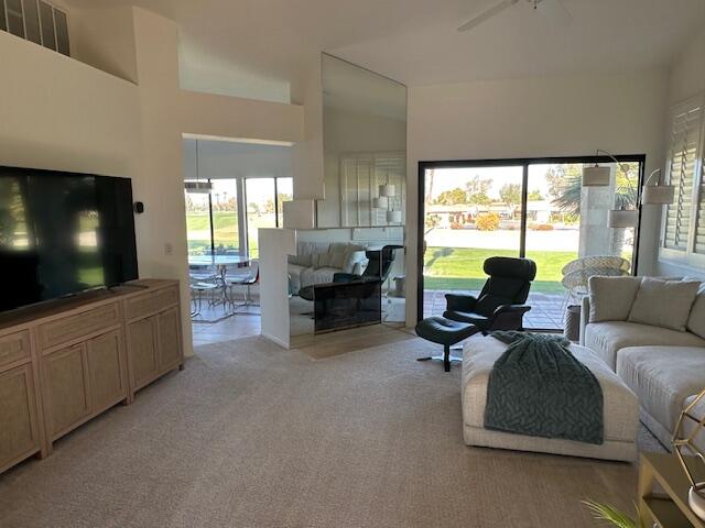 41869 Preston Trail Palm Desert, CA 92211 - Photo 4 of 23 a living room with furniture and a flat screen tv