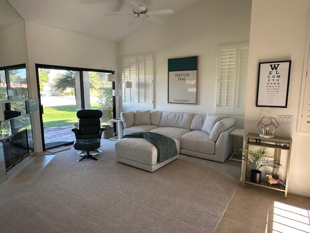 41869 Preston Trail Palm Desert, CA 92211 - Photo 5 of 23 a living room with furniture and a floor to ceiling window