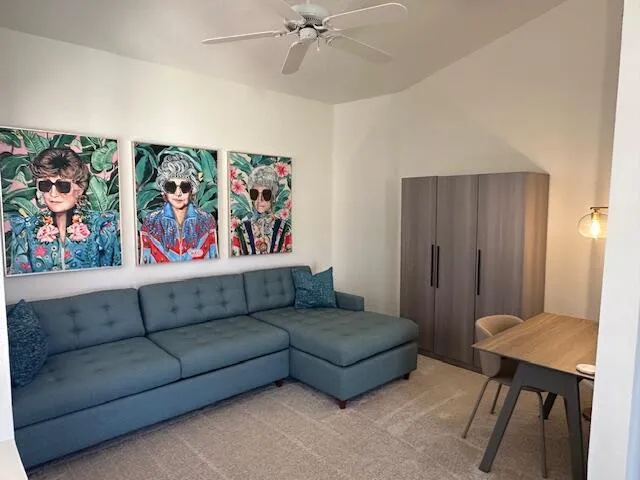 a living room with furniture and a table