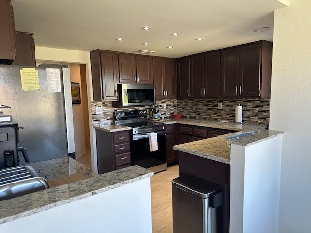 41869 Preston Trail Palm Desert, CA 92211 - Photo 9 of 23 a kitchen with a sink a stove a microwave and refrigerator