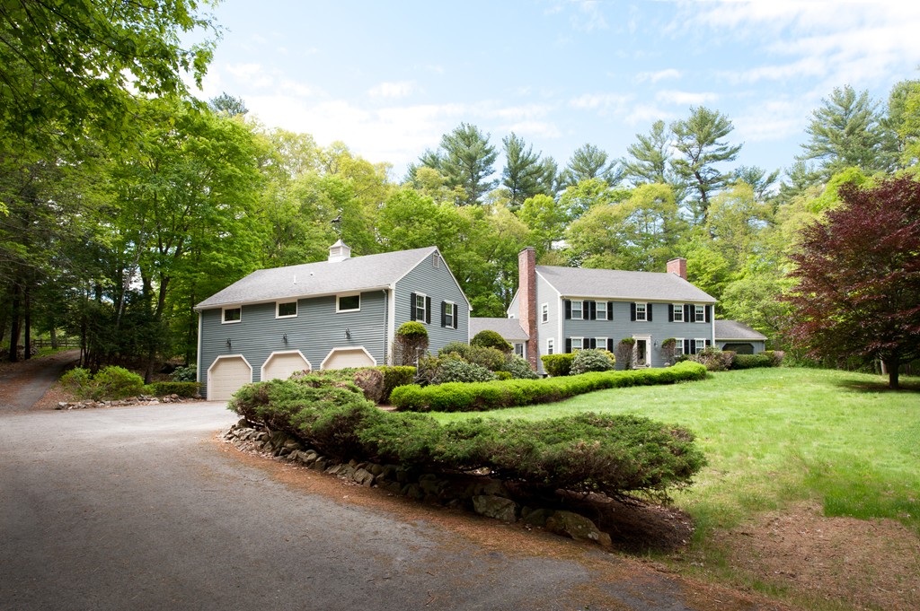 5 Holmes Road Boxford, MA 01921 - Photo 1 of 30 a front view of a house with a yard and garage