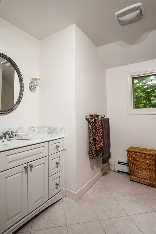5 Holmes Road Boxford, MA 01921 - Photo 17 of 30 a spacious bathroom with a double vanity sink and a mirror
