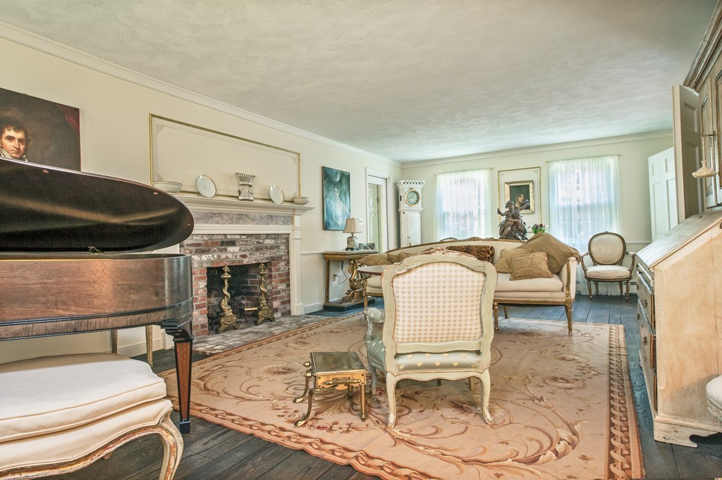 5 Holmes Road Boxford, MA 01921 - Photo 6 of 30 a living room with furniture a fireplace and a table