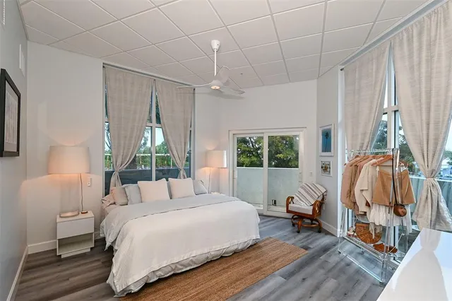 a bedroom with a bed and a television