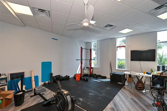 a living room with lots of gym equipment