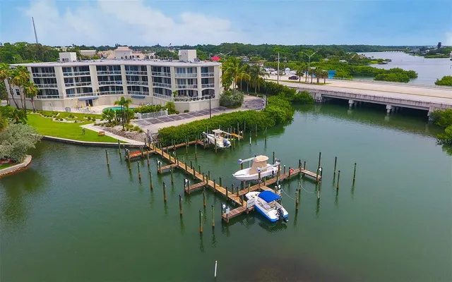 an aerial view of a house with a lake view