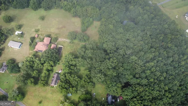 a backyard of a house with a yard and lake view