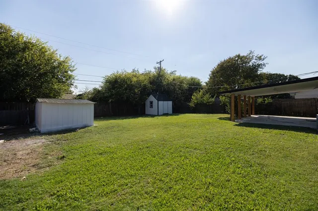 a backyard of a house with lots of green space