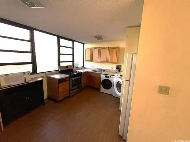 a utility room with washer and dryer