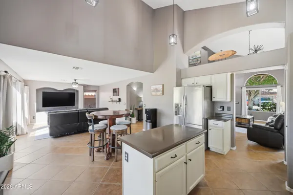 a kitchen with a stove a sink and a refrigerator