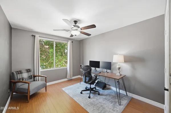 a bathroom with a sink a toilet and shower curtain