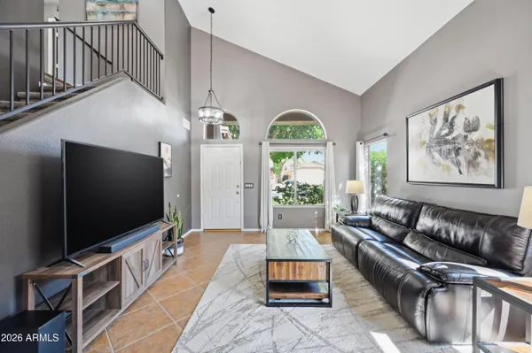a view of a house with a backyard porch and sitting area