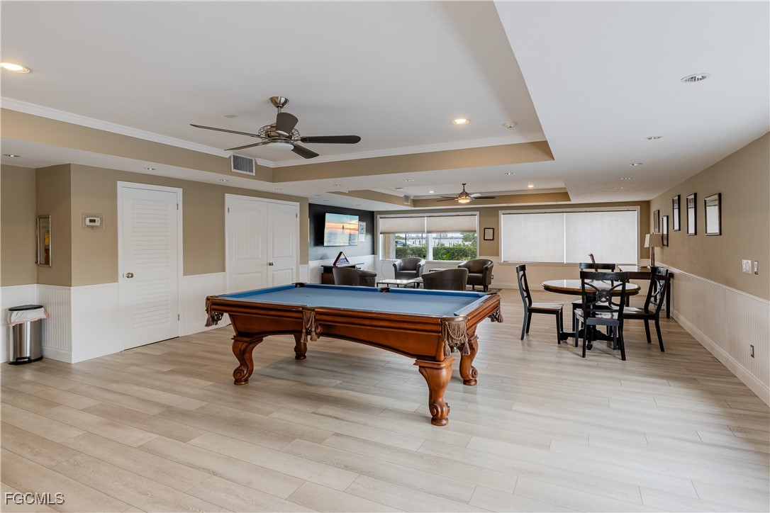 2875 Palm Beach Boulevard, Unit 607 Fort Myers, FL 33916 - Photo 22 of 35 a living room with furniture a table and a potted plant