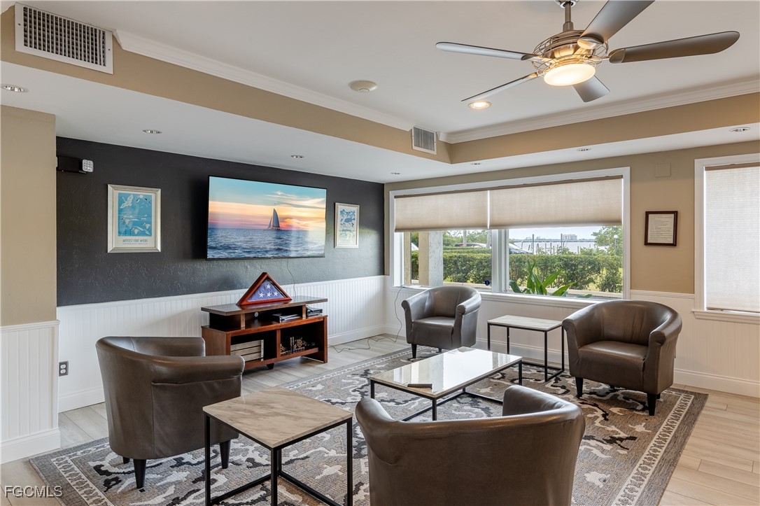 2875 Palm Beach Boulevard, Unit 607 Fort Myers, FL 33916 - Photo 24 of 35 a living room with furniture and a flat screen tv