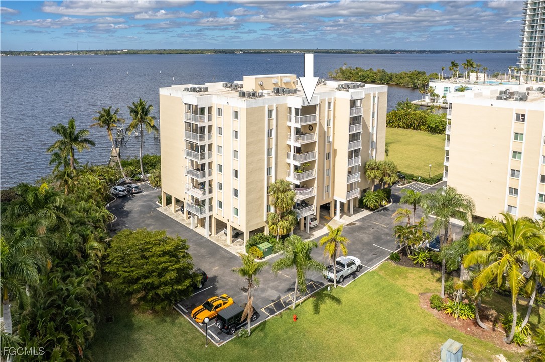 2875 Palm Beach Boulevard, Unit 607 Fort Myers, FL 33916 - Photo 30 of 35 a view of building with an outdoor space