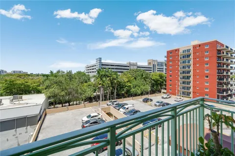 a view of a balcony with a table and chairs