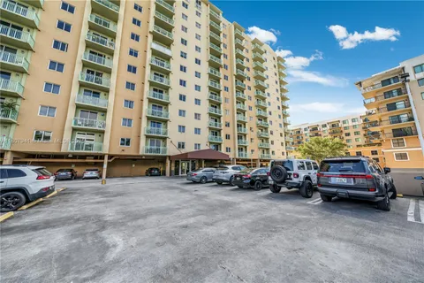 a view of cars parked in front of a building
