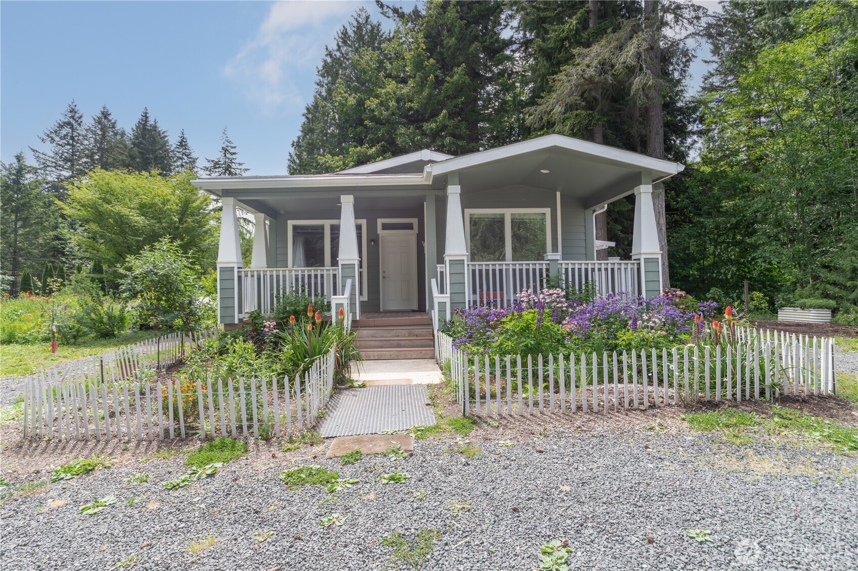 290 Werner Road Port Ludlow, WA 98365 - Photo 9 of 40 a front view of a house with a garden