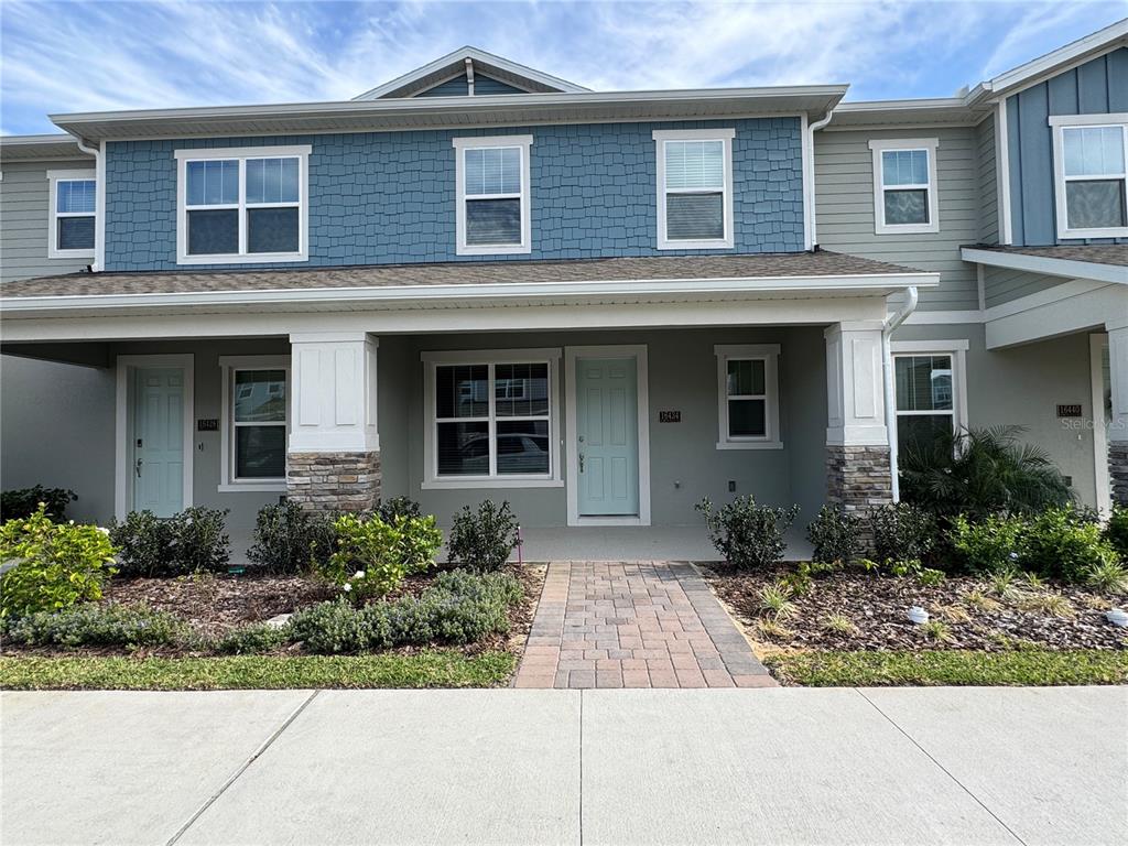 16434 Hamlin Hills Road Winter Garden, FL 34787 - Photo 1 of 50 a front view of a house with garden