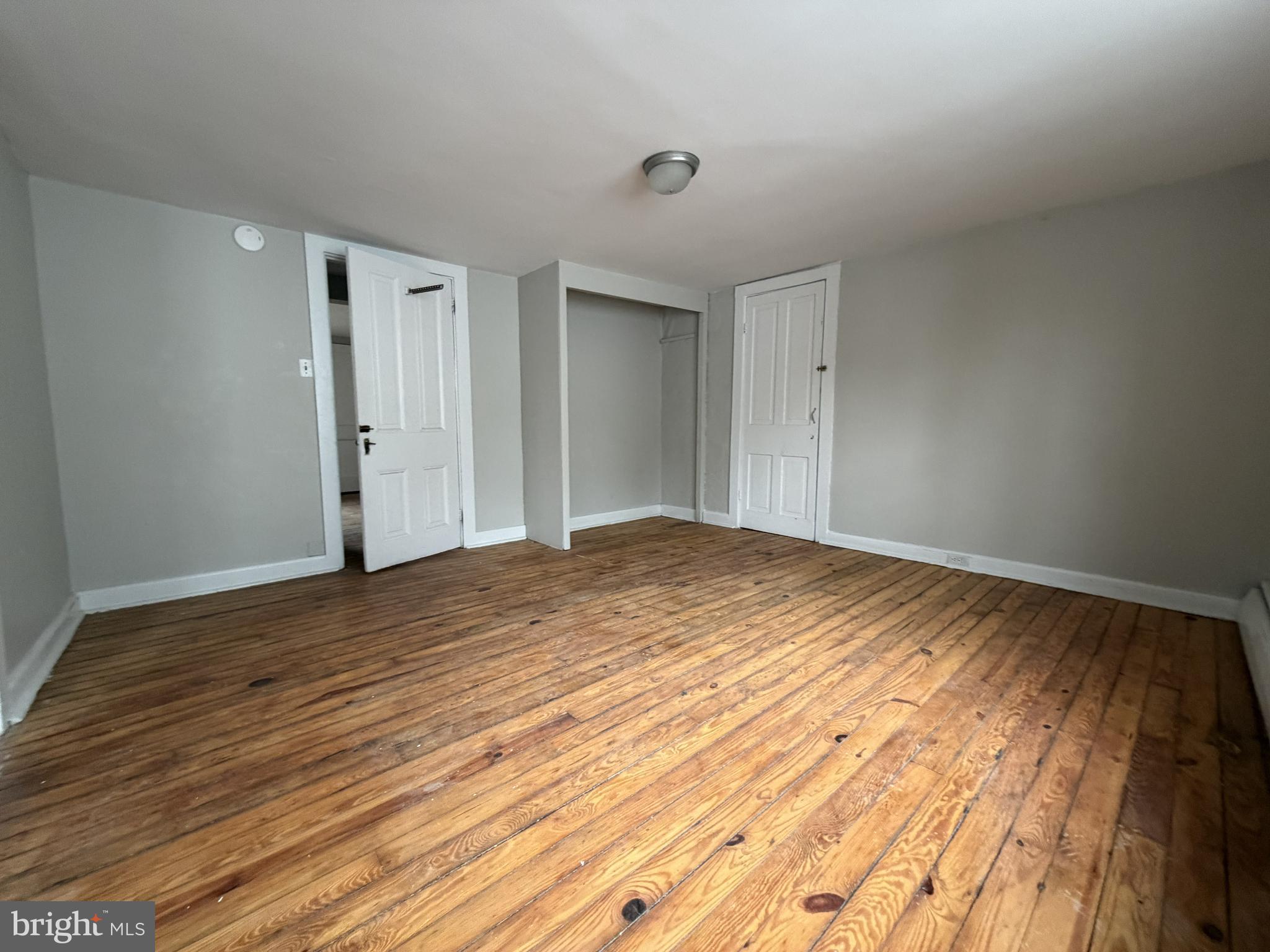 190 7th Street, Unit 1 Salem, NJ 08079 - Photo 10 of 16 a view of empty room with wooden floor