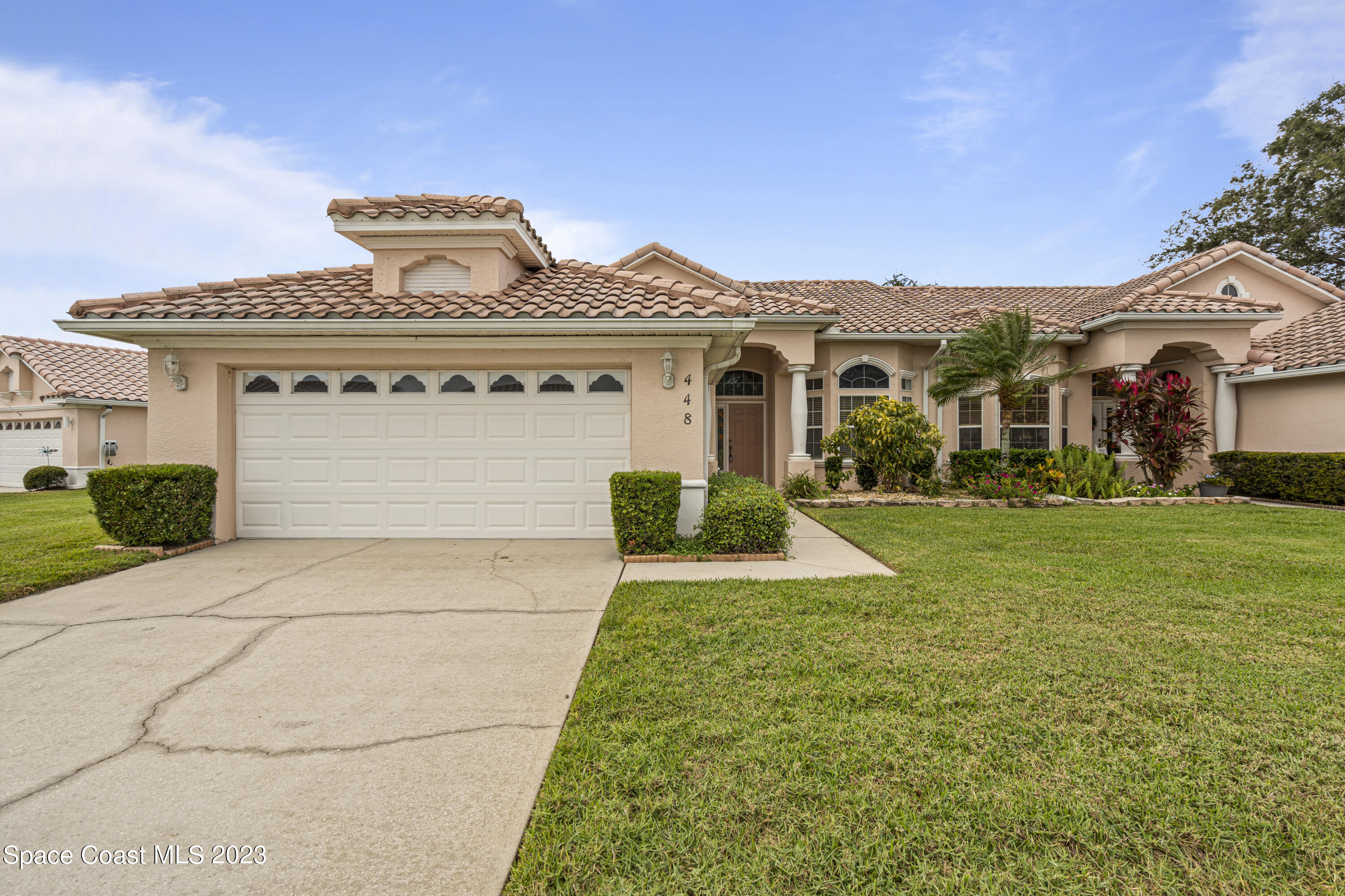 448 Renaissance Avenue Melbourne, FL 32940 - Photo 1 of 57 front view of house with a yard