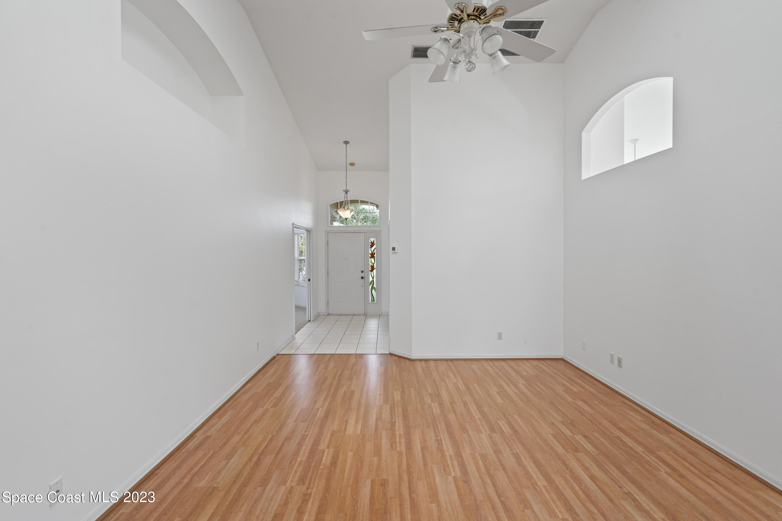 448 Renaissance Avenue Melbourne, FL 32940 - Photo 21 of 57 a view of empty room with wooden floor